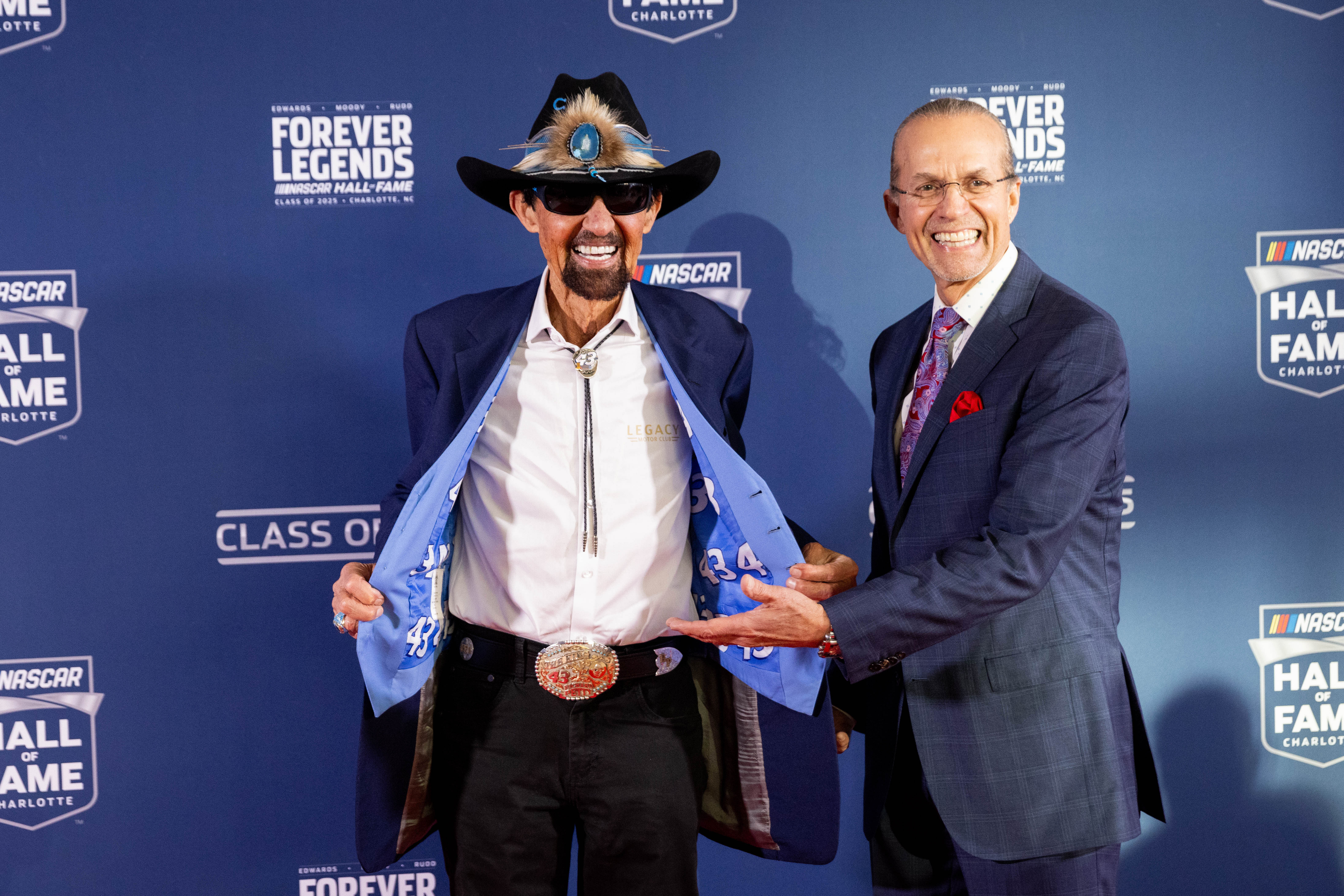 Former NASCAR driver Richard Petty with his son Kyle Petty on the 2025 NASCAR Hall of Fame red carpet. Source: Imagn